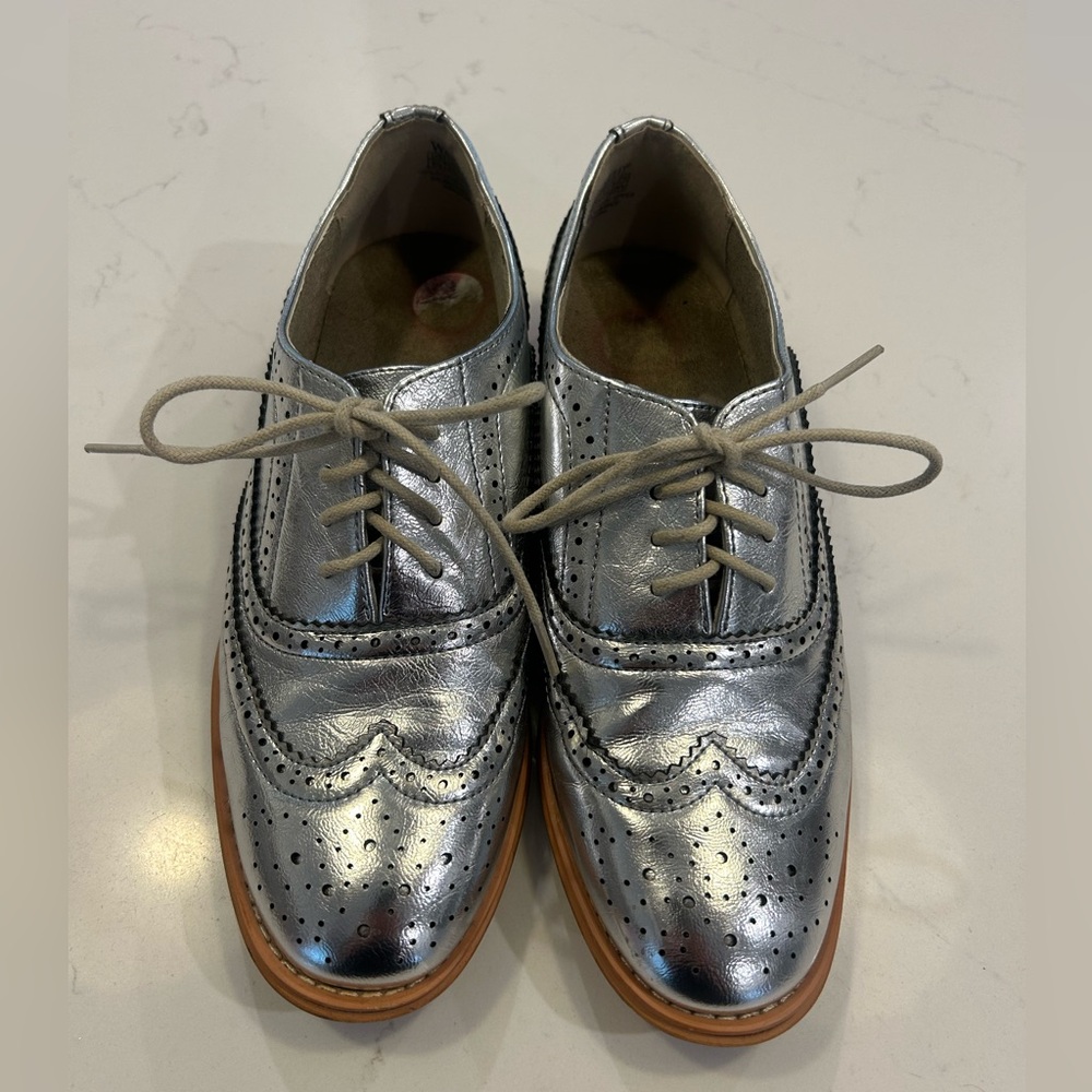 Silver Metallic Oxford loafers.